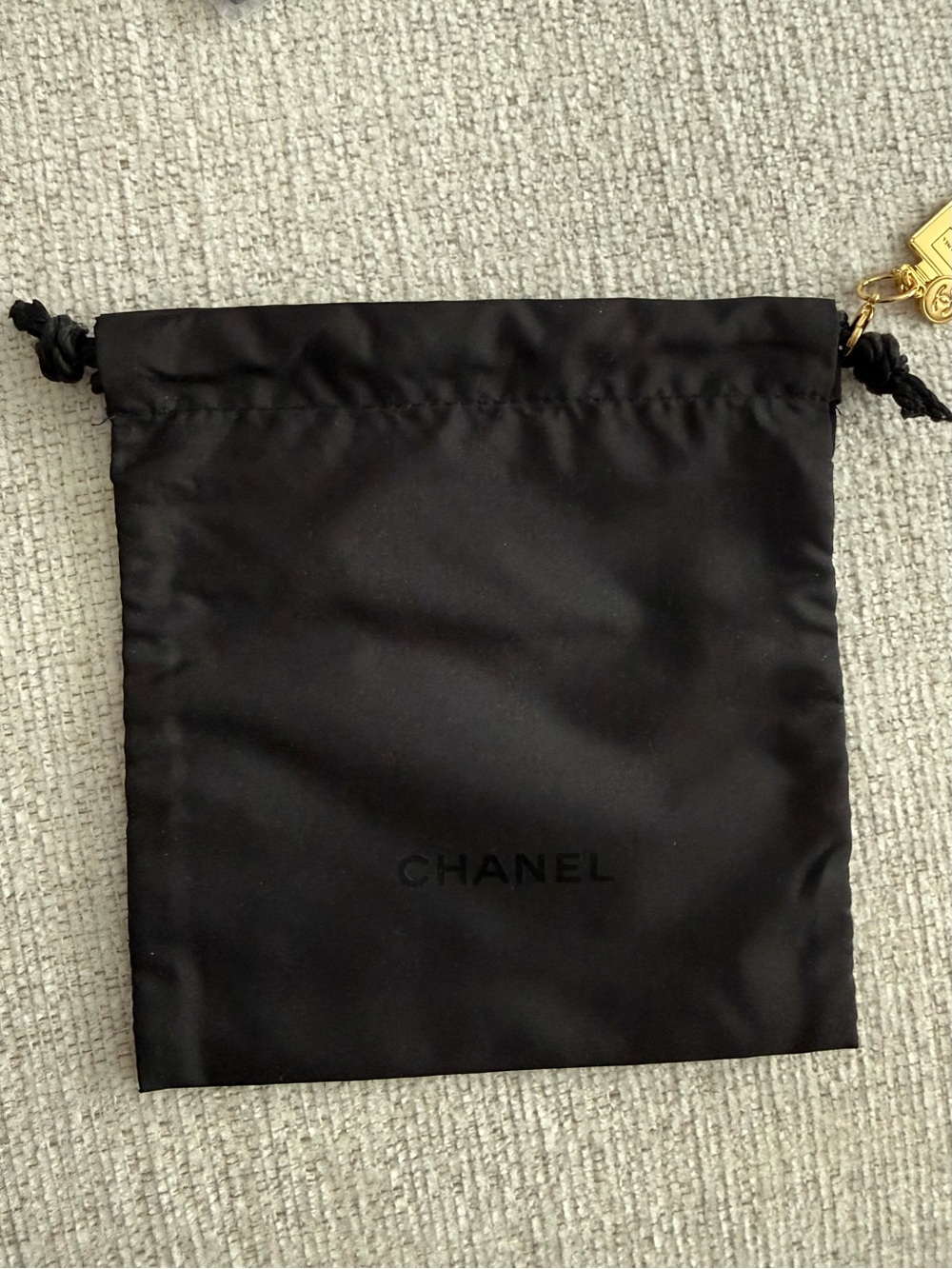 CHANEL Black Satin Drawstring Pouch with Gold Accent